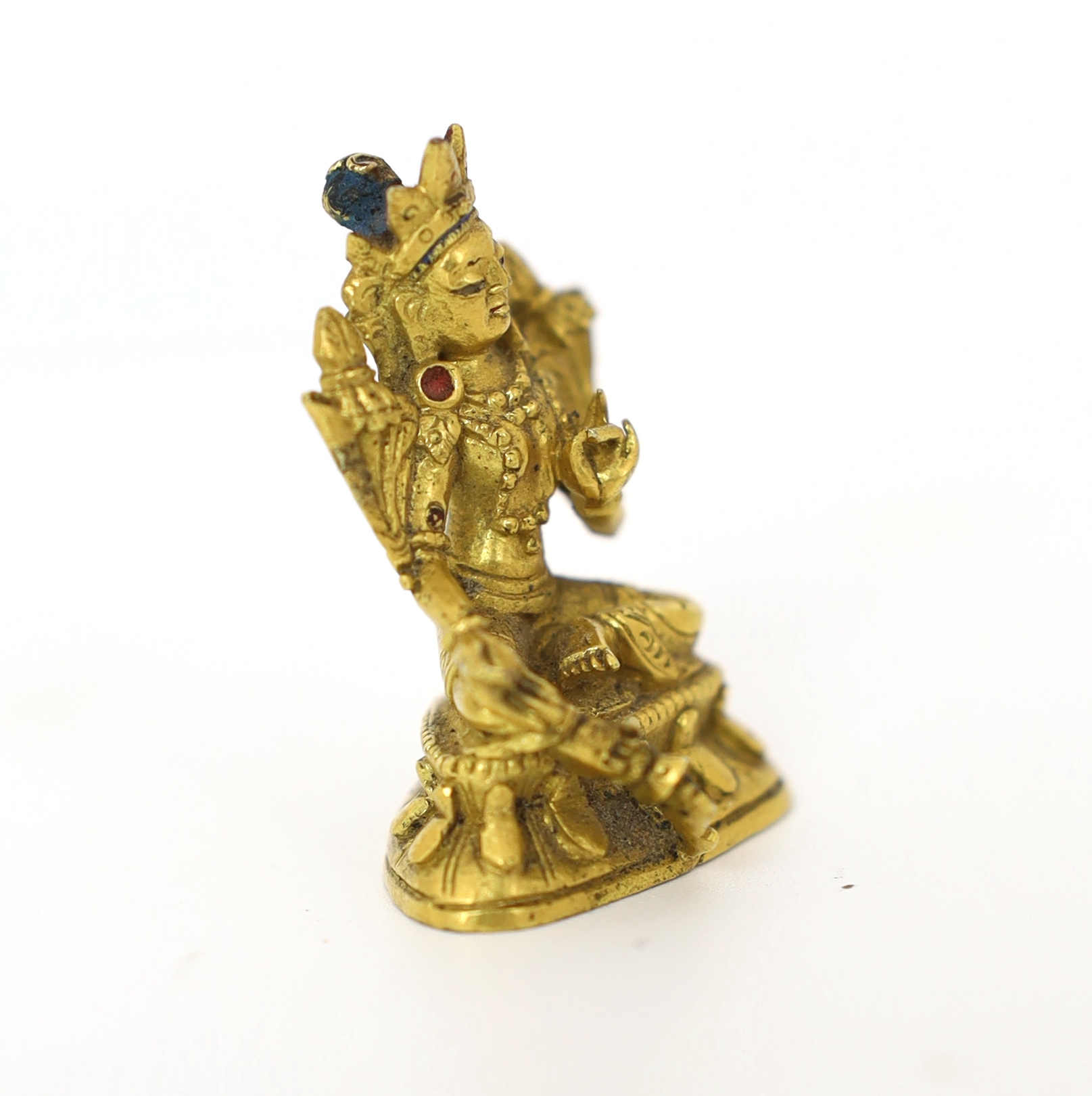 A Tibetan miniature gilt bronze figure of Green Tara, 18th/19th century